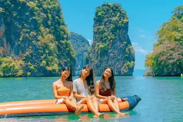 Guests canoeing among limestone cliffs on the James Bond Island tour from Phuket