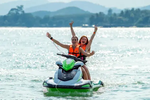 Guests riding a jet ski near Khai Island during their Phuket island trip