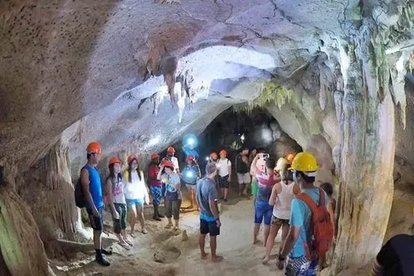 Guests exploring a limestone cave at Panak Island during the James Bond Island tour from Phuket