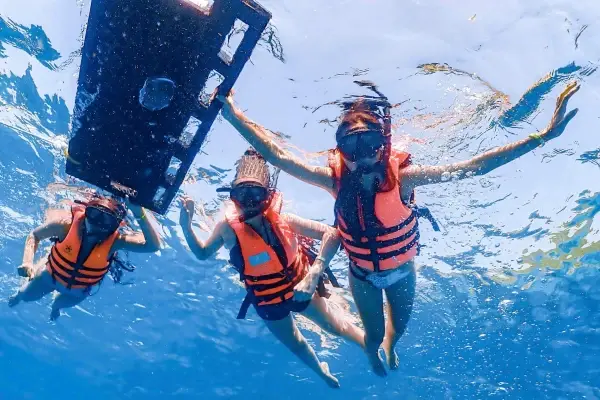 Guests snorkeling in clear water during the James Bond Island snorkeling tour from Phuket