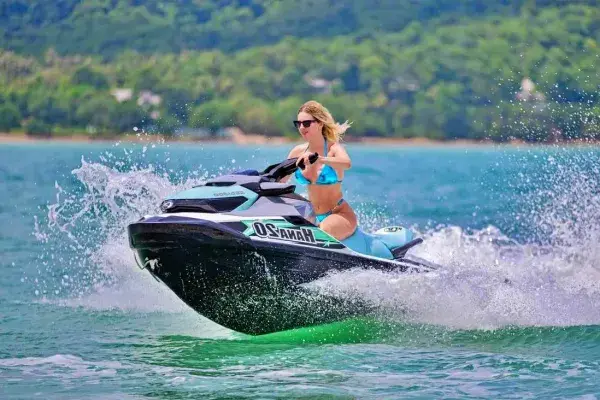 Guest riding a jet ski at Khai Island during the James Bond Island tour from Phuket