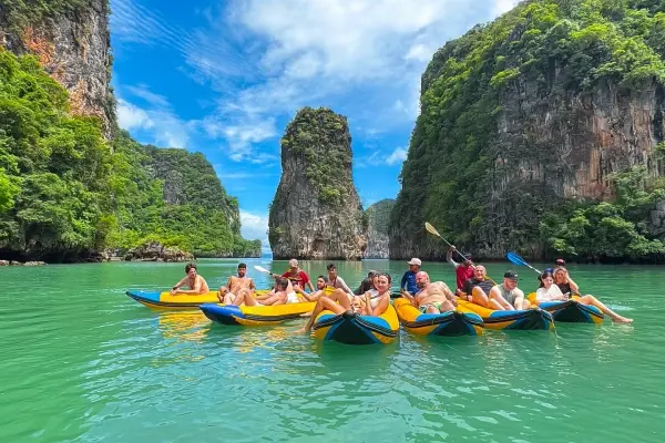 Guests enjoying sea cave canoeing during a James Bond Island Tour by Big Boat from Phuket