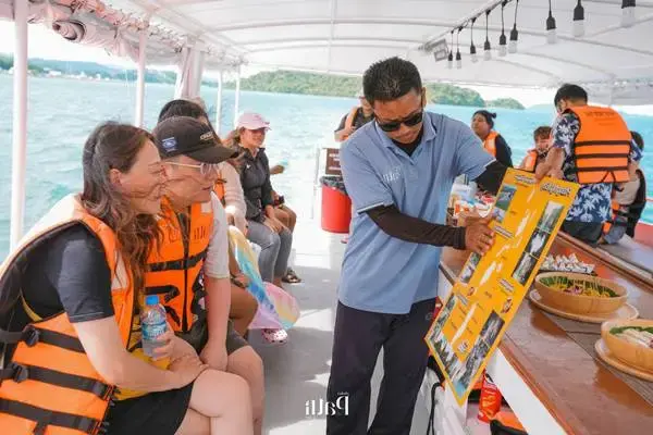 Tour guide briefing guests on a James Bond Island Big Boat Tour from Phuket
