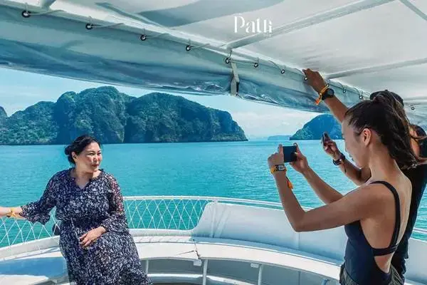 Passengers taking photos during a James Bond Island Big Boat Tour in Phang Nga Bay