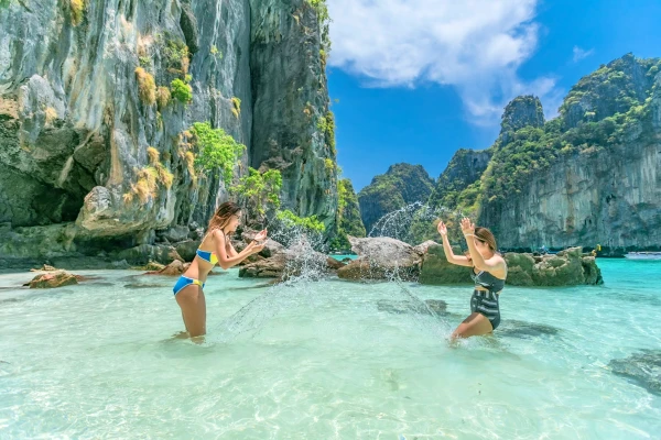 Travelers enjoying clear tropical water during the Phi Phi Island Sunset Tour from Phuket