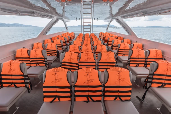 Passenger seating with life jackets inside a premium speed catamaran for a Phi Phi Island tour from Phuket