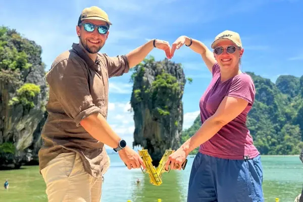 Tourists visiting James Bond Island during a speedboat tour from Phuket