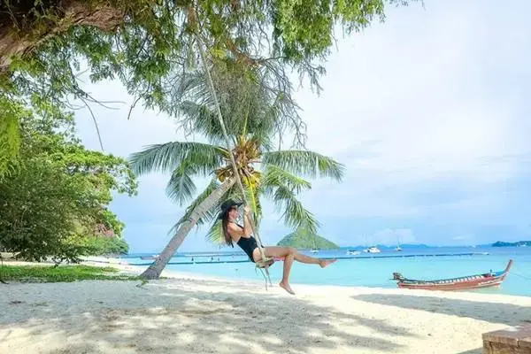Naka Island beach relaxation during the James Bond Island Tour from Phuket by Speedboat