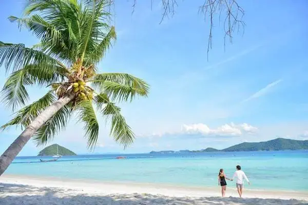 Tourists walking on a tropical beach during the James Bond Island Tour from Phuket