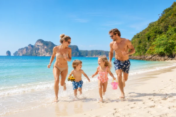 Family enjoying a tropical beach during a Phi Phi Island cruise tour from Phuket