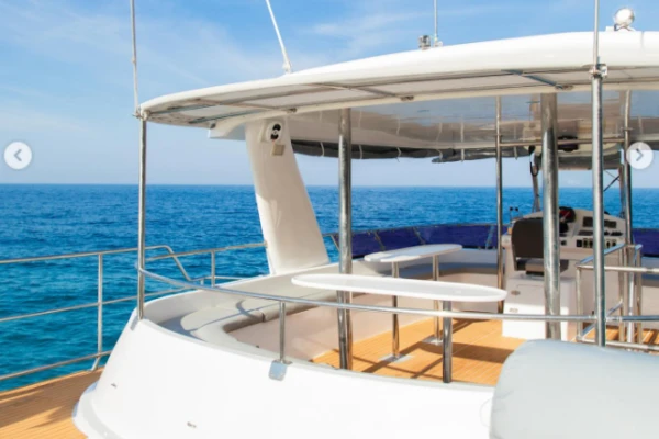 Spacious outdoor deck and seating area on a comfortable catamaran cruising the Andaman Sea from Phuket