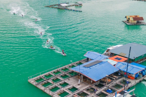 Jet Ski Tour Phuket Program G1 riders following the guided sea route near a floating coastal stop